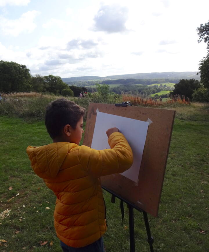 Boy drawing at Newlands Corner